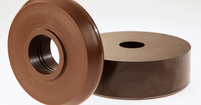 Low friction polymer with wear resistance being used as a spin wheel in a fixture production manufacturing plant